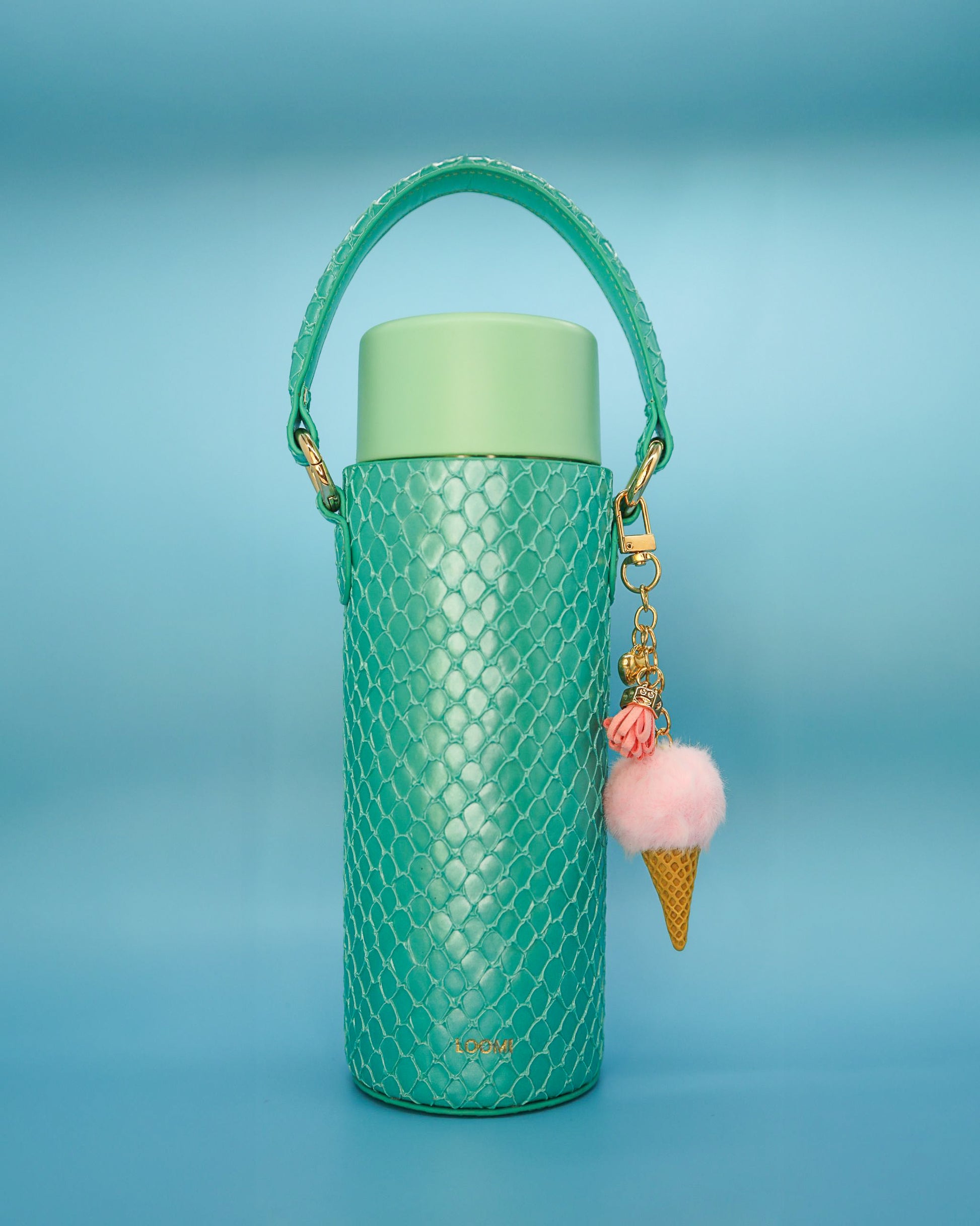 green water bottle with a pink ice cream charm 